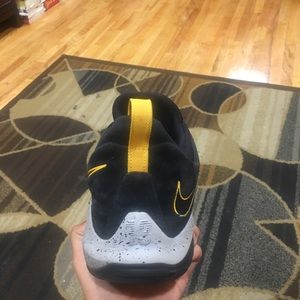 Paul George; black and yellow; size 13;